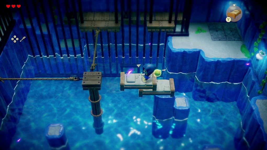 Zelda bahnt sich den Weg durch eine Höhle voller Wasser.