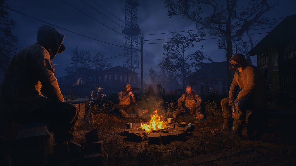 Figuren in Stalker 2, die zusammen am Lagerfeuer sitzen