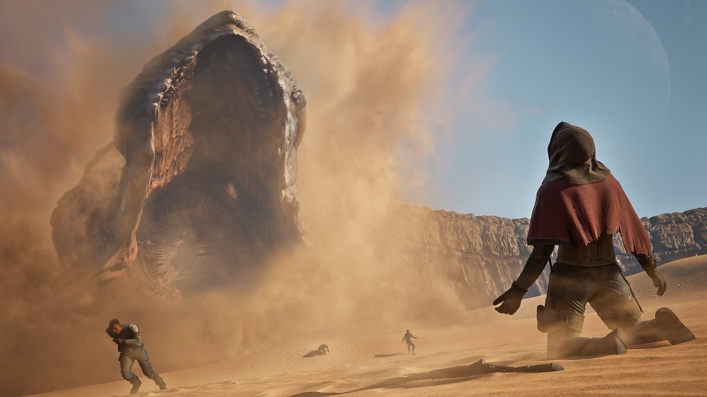 Ein Sandwurm schießt aus dem Sand, ein Mensch kniet flehend am Boden