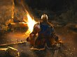 Ein Ritter sitzt am Leuchtfeuer.