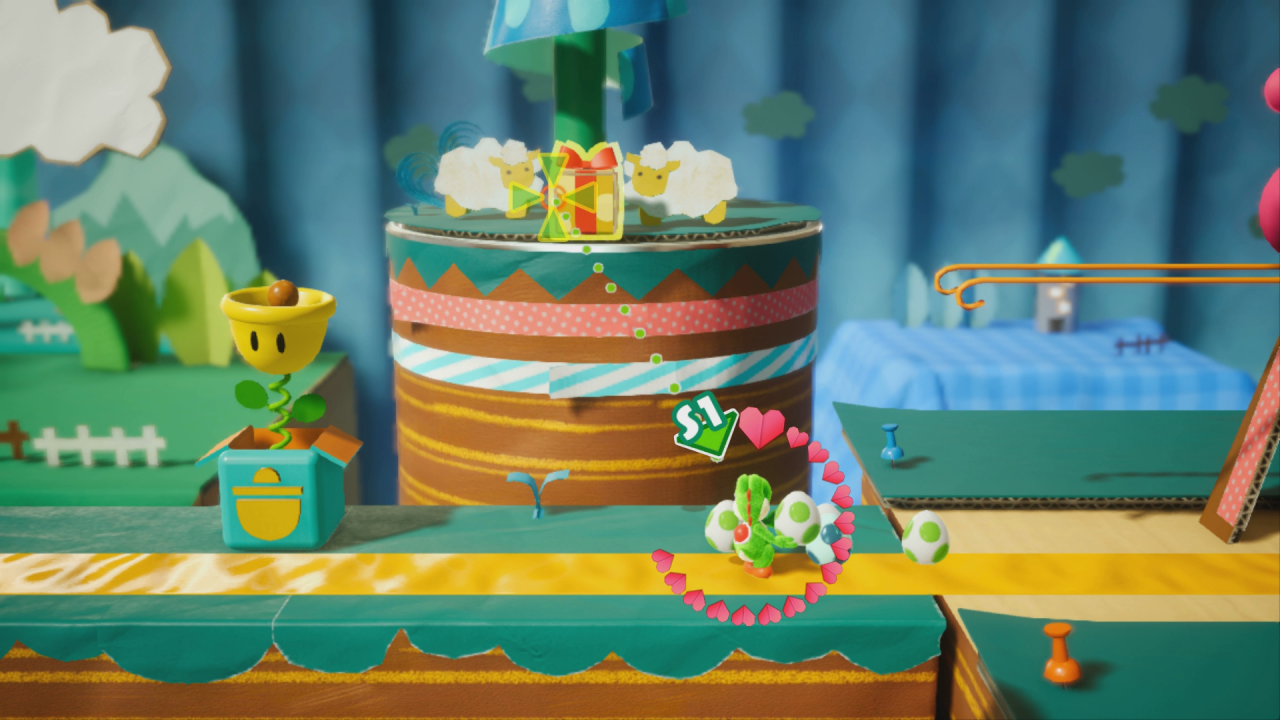 [28/03/2019] Yoshi's Crafted World: Welt 2 - Level 1: Schnuffel auf der Rolle: In diesem Geschenk im Hintergrund befinden sich rote Münzen - abschießen!