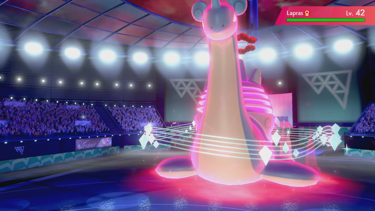 [04/12/2019] Lapras umgeben in seiner Gigadynamax-Form einige Schweife, die an Notenzeilen aus der Musik erinnern.&nbsp;