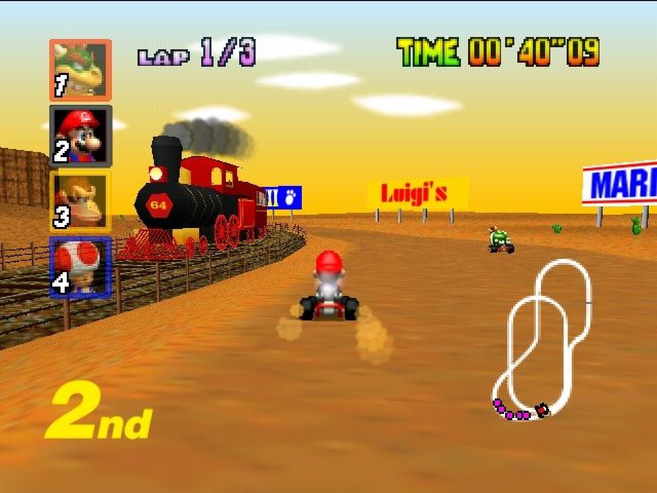 [18/03/2022] Die Nintendo-Crew unterstrich die 3D-Umgebung immer wieder mit optischen Ereignissen wie diesem vorbeirasenden Zug in der Kalimari-Wüste. &nbsp;