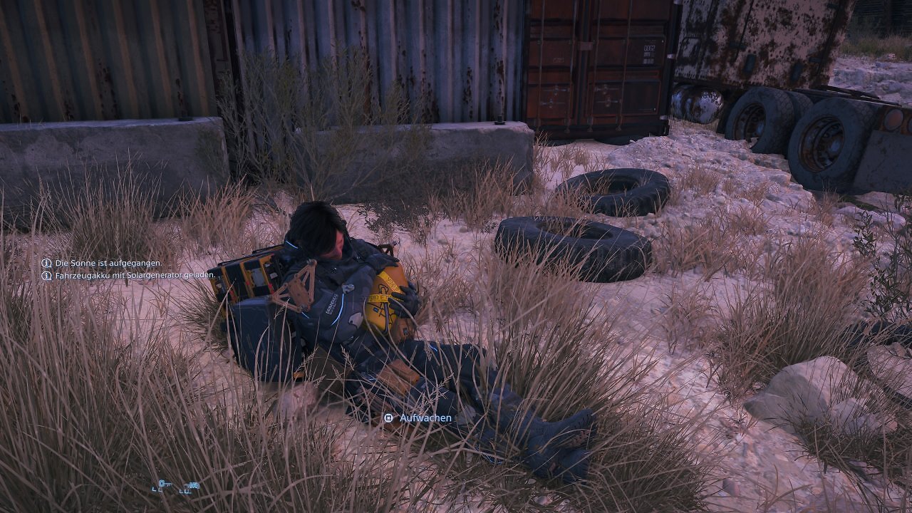 Sam aus Death Stranding 2 macht eine Pause und schlöft auf dem Boden.