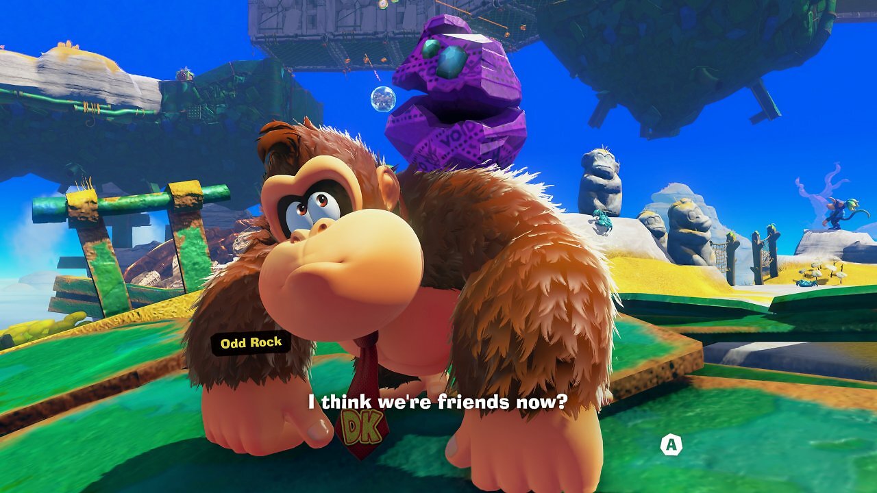 Donkey Kong schließt sich mit einem sprechenden Felsbrocken zusammen.