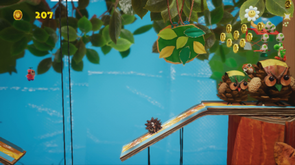 Yoshi's Crafted World: Welt 10 - Level 1: Abwägende Eicheln: Die sechste Blume des Levels findet ihr im Hintergrund in einer Wolke versteckt.
