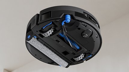 Ein schwarzer Saugroboter bei der Arbeit