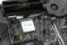 Hier sieh man einen AMD Ryzen im Sockel des Mainboards montiert, bevor der Kühler aufgesetzt wurde.