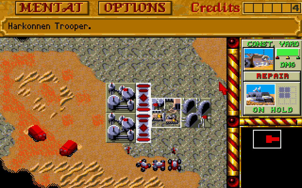 Vielfach kopiertes Konzept: Wer in Dune 2 – Kampf um Arakis (1992) Einheiten und Gebäude konstruieren will, muss Ernter losschicken (links im Bild), die eine wertvolle Ressource (hier Spice genannt) abbauen und zur Basis bringen, wo sie dann in Credits umgewandelt wird.