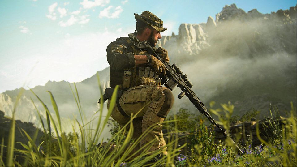 Captain Price kniet mit Waffe in der Hand im Gras